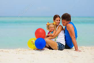 Happy family have a party on tropical beach