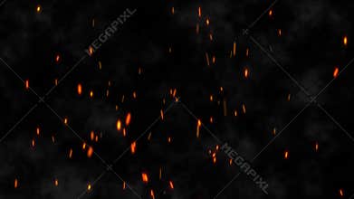 Shot of flying fire sparks in the air on black background. Burning hot bonfire fire sparks on a dark background.