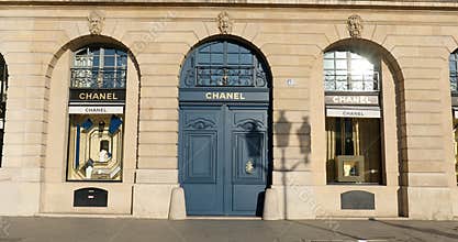 Chanel luxury store in Place Vendome in Paris, France, man passing