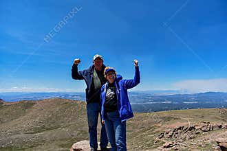Strong Old Married Couple Enjoying the Top of Pike`s Peak