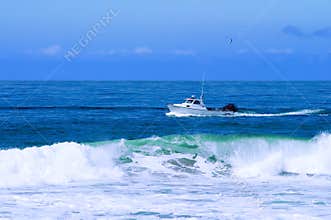Fishing Boat Trawling For Fish And Checking Lobster Traps