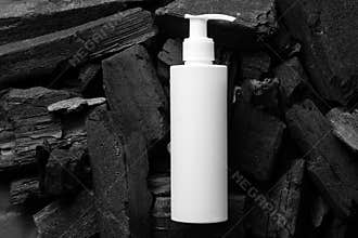 Mock up cosmetic jar with cream, shampoo, serum. The background is black coal. Black design.