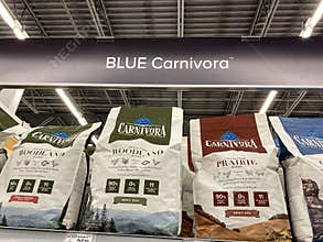 A display of Blue Wilderness Carnivora Dog Food at a Petsmart Superstore