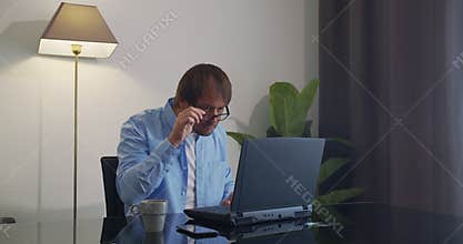 CloseUp. Shocked Man Wondering and Working on Laptop.