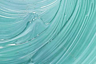 Cosmetic gel texture. Blue transparent skincare product smudged background