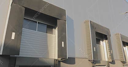 Warehouse Dock Door. Loading dock ramps at distribution warehouse