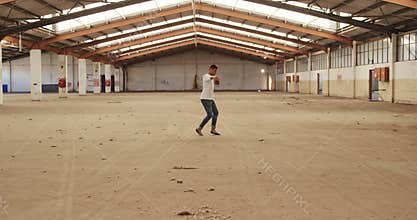 Male dancer in an empty warehouse