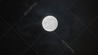 Full moon against cloudy night sky
