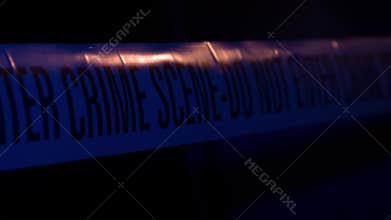 Police Crime Scene Cordon Tape Illuminated by Blue Strobe Light