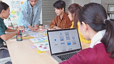 Young Asian business creative team work together, mobile application software design project. Brainstorm meeting concept