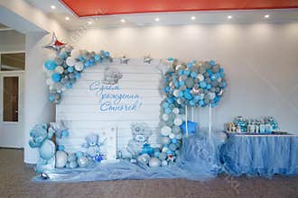 One year boy party decorations with balloons and candy bar