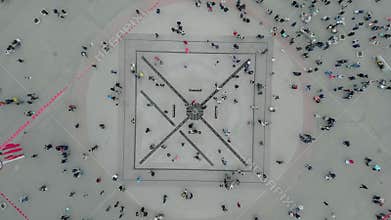Aerial top down 4k view of people walking in the square