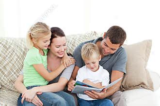 Adorable father and son reading a book