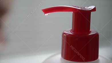 Washing hands with alcohol sanitizer