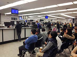 Department of motor vehicles DMV California America people waiting in crowded line