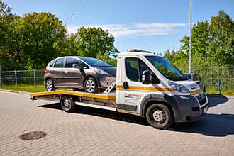 Honda car on tow truck for emergency car move