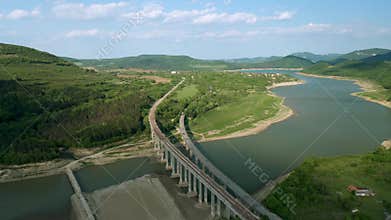 A picturesque valley with a drying dam and bridges