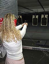 Woman shooting a gun