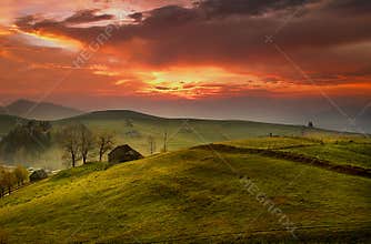 Scenic Sunrise In Beautiful Morning Light With Traditional Old House in Foreground