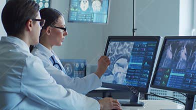 Medical doctors working in hospital office making computer research. Medicine, healthcare and technology concept.