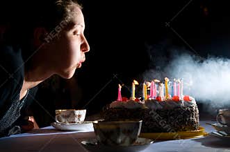 Blowing out candles on cake