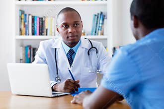 African american male doctor listening to infected patient