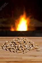 Wooden pellets in front of Biomass Heater
