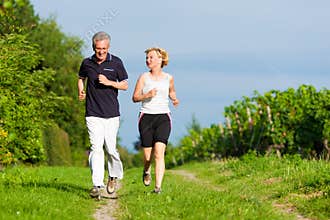 Senior couple jogging for sport