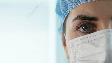 Close up of female doctor or nurse in face mask
