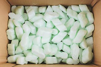 Box filled with polystyrene foam peanuts packaging filler cushioning material