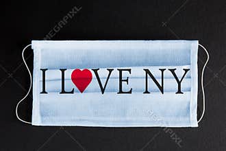Coronavirus Covid-19 in New York. Words I LOVE NY printed on medical mask. City healthcare concept.
