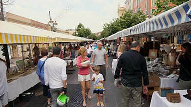 Nice Monday Antique market shoppers passing by.