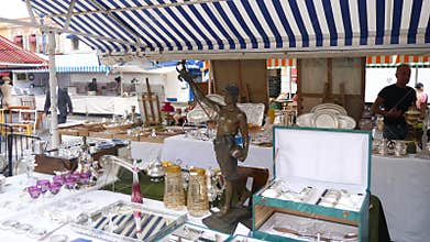Nice Monday Antique market Panning around stalls and people.