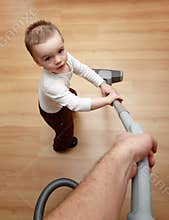 Boy hoovering