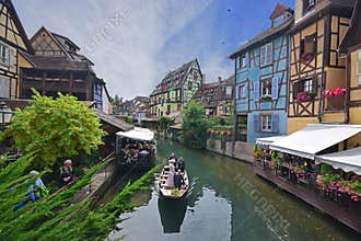 Wedding photography on a small boat cruising through Lauch River at Little Venice of Colmar, France