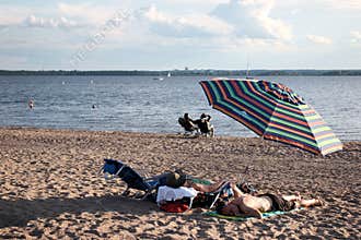 People sleeping on the beach, Quebec
