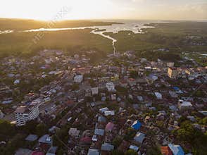 Aerial Drone shot of Chake Chake City, a Capital of Pemba island, Zanzibar archipelago. City in a river Delta at sunset