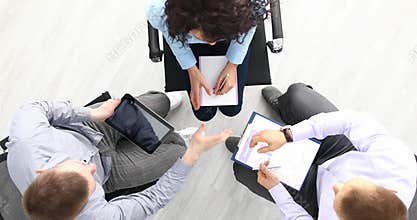 Group of people shaking hello and starting business meeting