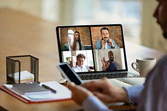 Remote meeting. Man working from home during coronavirus or COVID-19 quarantine, remote office concept.
