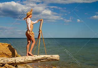 girl paints an easel
