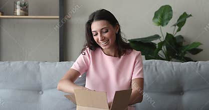 Indian woman prepare parcel box for send to relatives