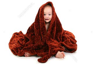 Beautiful 10 Month Old Baby Wrapped In Brown Fuzzy Blanket