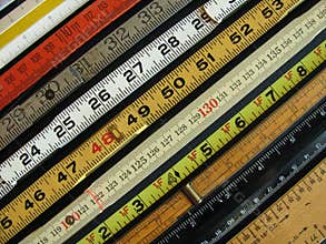 Diagonal rulers illustrate measurement, accuracy.