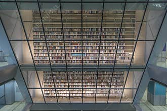 Books begind glass in library