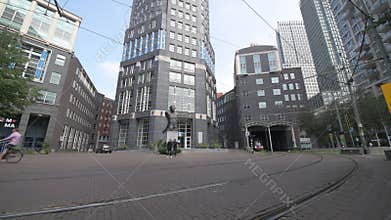 Red and dark brown tram in The Hague city center
