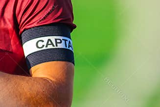 Captain`s armband on hand