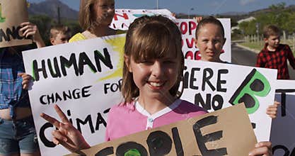 Girl with climate change sign in a protest