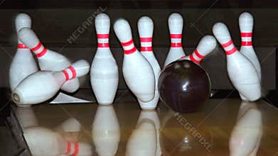 Bowling ball and falling pins