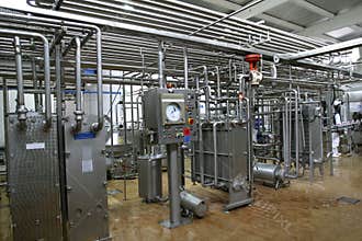 Temperature control valves and pipes in dairy production factory