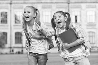 Children are the future. Happy children have fun outdoors. Little children hold study books. Small children back to